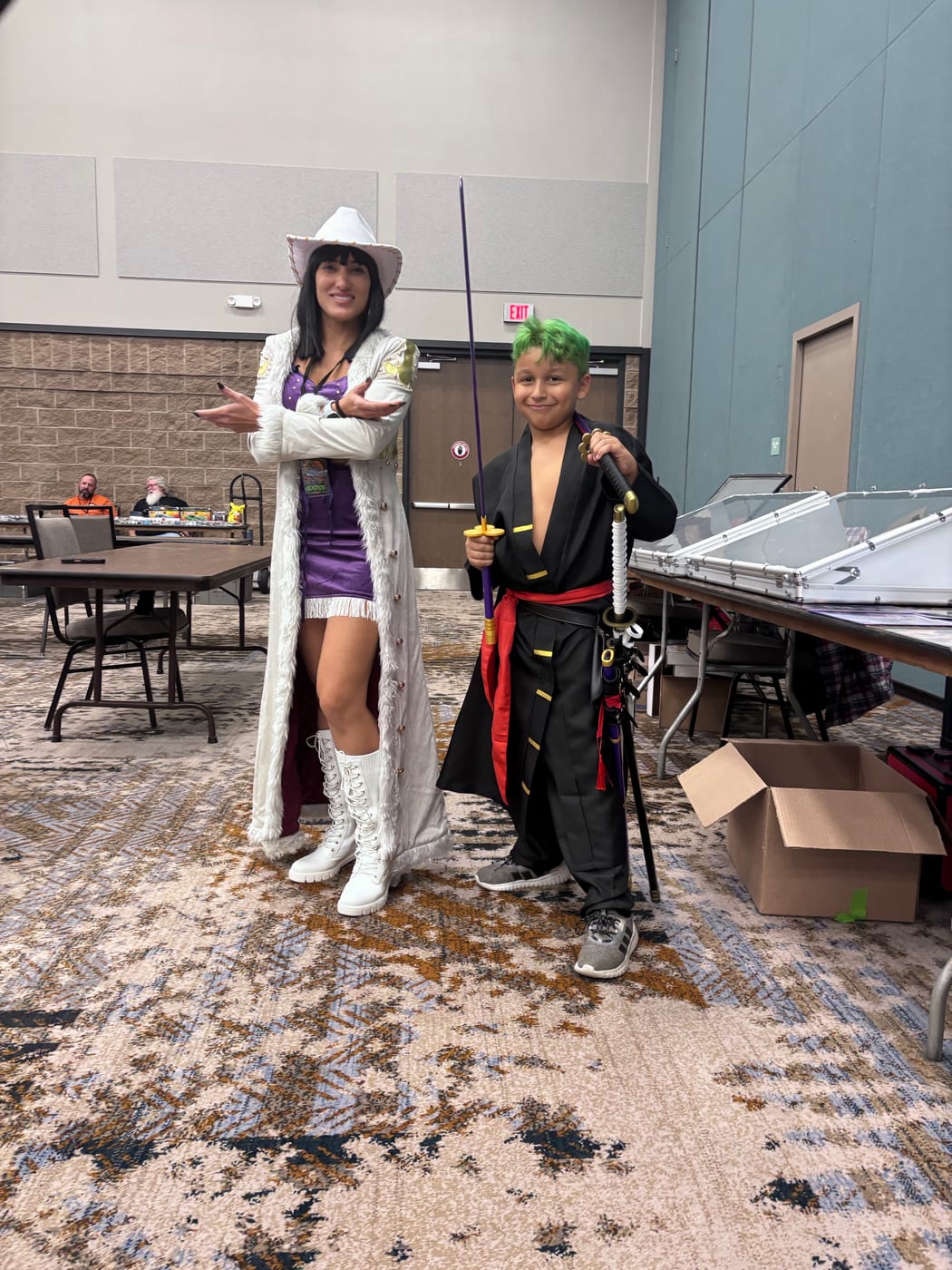Two One Piece cosplayers posing together on the show floor at a past 940 Collector's Expo